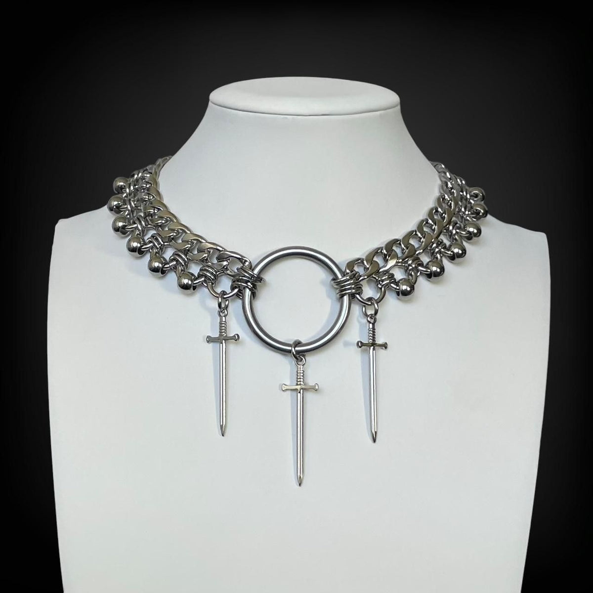Silver dagger pendant necklace on chain