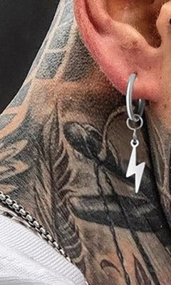 Silver lightning bolt huggie earring worn