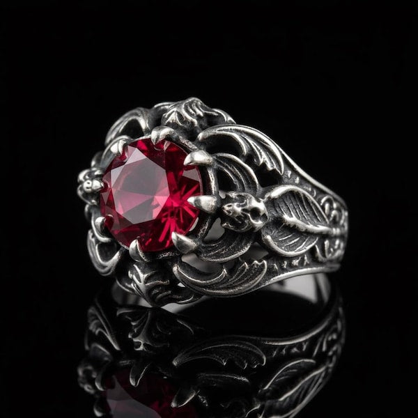 Silver carved ring with red stone