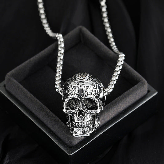 Silver skull pendant necklace on chain